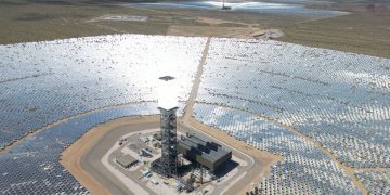 Expansive solar power plant in the California desert, showcasing renewable energy technology.