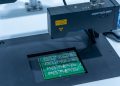 Close-up of a PCB inspection machine in action, highlighting technology.
