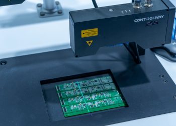 Close-up of a PCB inspection machine in action, highlighting technology.