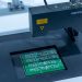 Close-up of a PCB inspection machine in action, highlighting technology.
