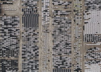 High-angle aerial shot of a massive car parking area, filled with vehicles in Brazil.