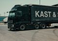 A large industrial truck parked in an urban setting, showcasing transportation industry visuals.