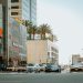 View of a busy street in Dubai's Marina District featuring modern architecture and vibrant traffic.