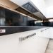 Sleek modern kitchen design featuring white cabinets and Soviore brand details.