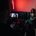 Behind the scenes of a studio filming session focused on actors within a creative setup.