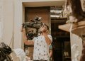 Professional camera operator handles a dynamic camera rig in an artistic studio setting.