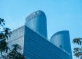 Low angle view of Hangzhou Century Center skyscrapers against a clear sky.