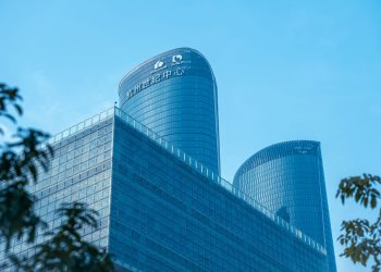 Low angle view of Hangzhou Century Center skyscrapers against a clear sky.