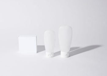 Minimalist white cosmetic containers with shadows, perfect for product mockups and ad designs.