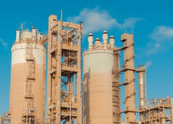 A view of urea towers at an industrial plant in Libya, captured on a clear day.