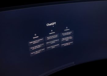 Close-up of a computer screen displaying ChatGPT interface in a dark setting.