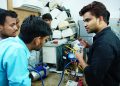 Participants learn AC repair during a hands-on session in Delhi, India.