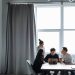Group of diverse professionals collaborating in a modern office setting.