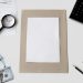 Flat lay of financial tools and blank paper for planning or mockup.