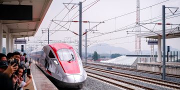A sleek high-speed train arriving at Padalarang Station, offering modern transportation in Indonesia.