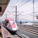 A sleek high-speed train arriving at Padalarang Station, offering modern transportation in Indonesia.