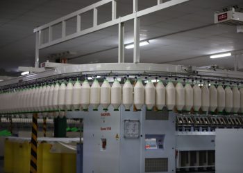 Industrial textile factory with yarn production line showcasing automated machinery for efficient manufacturing.