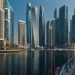 Explore the towering skyscrapers of Dubai Marina reflecting beautifully on the water.