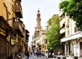 Explore the charm of a bustling historic street in Cairo with stunning architecture and cultural vibrancy.