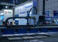 A view of advanced industrial machinery displayed at a trade fair exhibit.