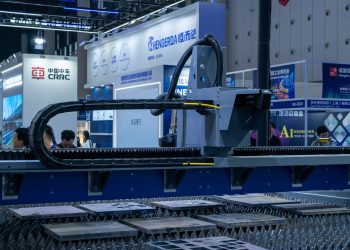 A view of advanced industrial machinery displayed at a trade fair exhibit.