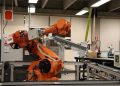 Industrial robotic arm in a Ciudad de México lab setting, showcasing automation technology.