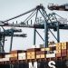 A view of large cranes and cargo containers at the busy Abidjan Terminal port.