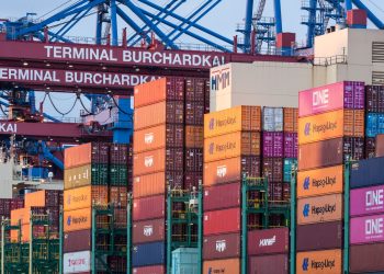 Container stacks and cranes at Terminal Burchardkai in Hamburg, Germany port.