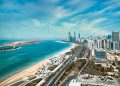 Breathtaking aerial image capturing the modern skyline and beautiful coastline of Abu Dhabi.