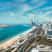 Breathtaking aerial image capturing the modern skyline and beautiful coastline of Abu Dhabi.