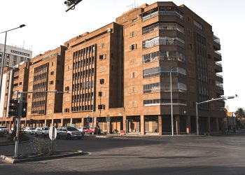 Urban scene with modern buildings and street traffic in Riyadh.
