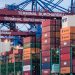 View of shipping containers and cranes at Hamburg's Burchardkai terminal.