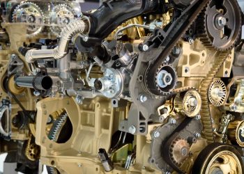 Detailed view of a modern car engine showcasing gears and mechanical components.