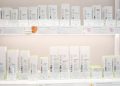 Neatly arranged Ultraceuticals skincare products on bright store shelves.