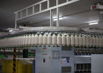 Industrial textile factory with yarn production line showcasing automated machinery for efficient manufacturing.
