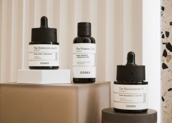 Elegant display of COSRX skincare bottles on a modern backdrop. Perfect for beauty and wellness content.