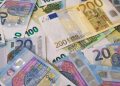 Image of various Euro banknotes spread out, captured in Berlin.